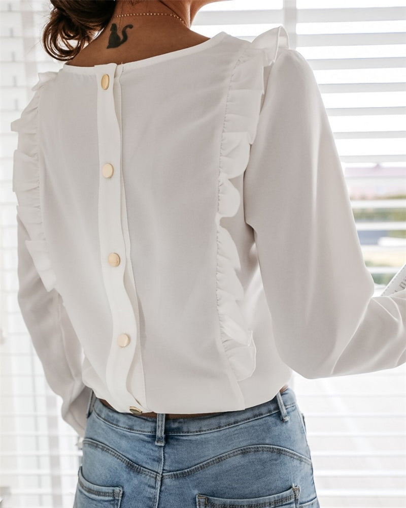 Elegante blouse met ruches en knopen